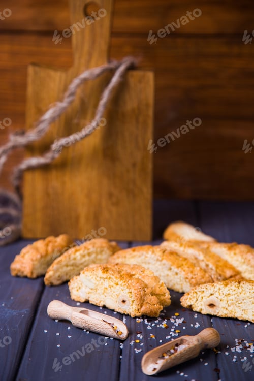 Preview: Crispy Salted Bread, Scoop With Salt Crystalls On Wooden Table. Salty Junk, Unhealthy Snacks, Fast