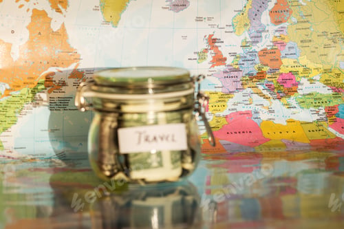 Preview: Travel Money Savings In A Glass Jar With Map In Background
