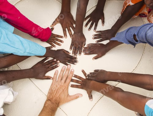 Preview: Hands On Sands Of Black Children From Africa Together With Hand Of A White Man