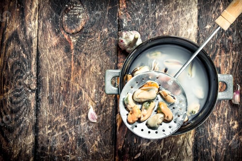 Preview: Boiled Mussels In A Bowl. On A Wooden Background.
