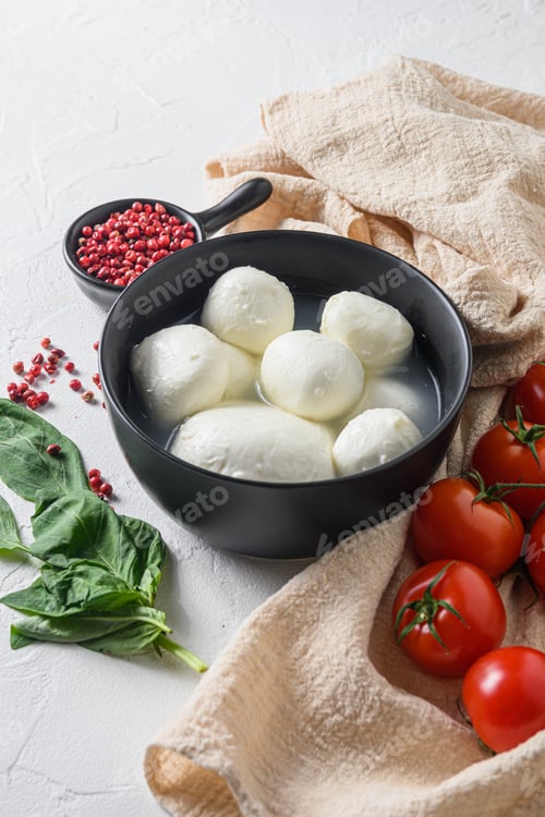 Preview: Mozzarella Buffalo In Black Bowl, Fresh Basil, Red Tomatoes And Olive Oil. Italian Cuisine, Healthy