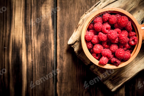 Preview: Wild Raspberry In The Cup. On A Wooden Table.