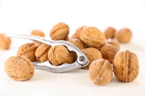 Preview: Walnut And Nutcracker On White Background