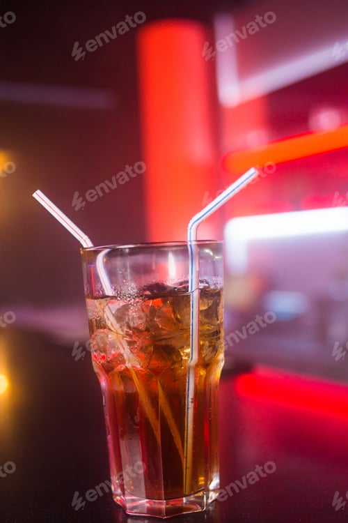 Preview: An Alcoholic Red Cocktail Is In Beautiful Glass, In The Restaurant