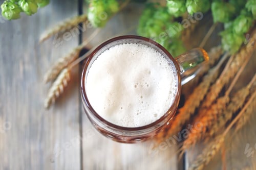 Preview: A Glass Of Wheat Beer On A Wooden Surface. Wheat And Hops. Beer Concept.