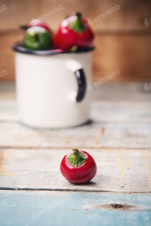 Preview: Many Raw Ripe Red And Green Pepper On Wooden Background
