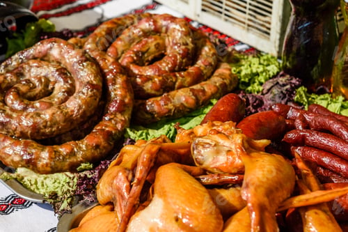 Preview: Homemade Sausage On A Green Lettuce Leaves