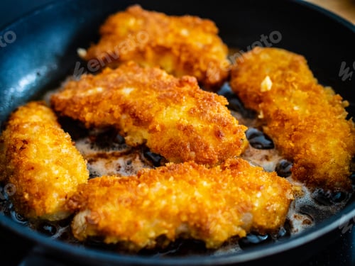 Preview: Breaded Chicken Breast Nuggets Frying In Pan