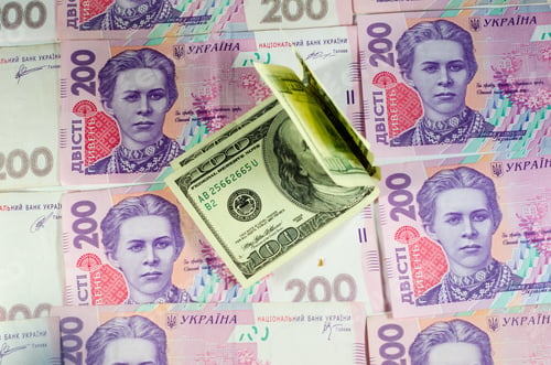 Preview: One Hundred Dollars Banknotes On The Heap Of Ukrainian Hryvnas