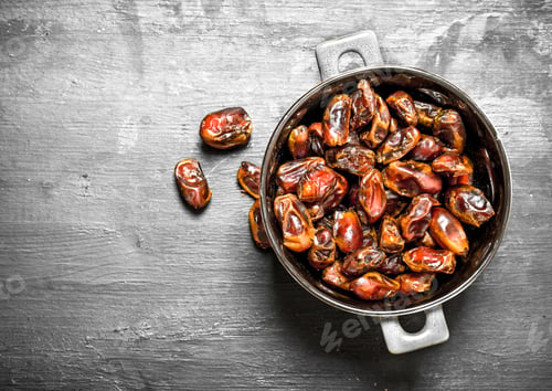 Preview: Dates In A Bowl. On A Black Chalkboard.