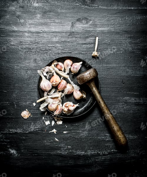 Preview: Garlic Background. Fresh Garlic And A Mortar With Pestle. On A Black Chalkboard.