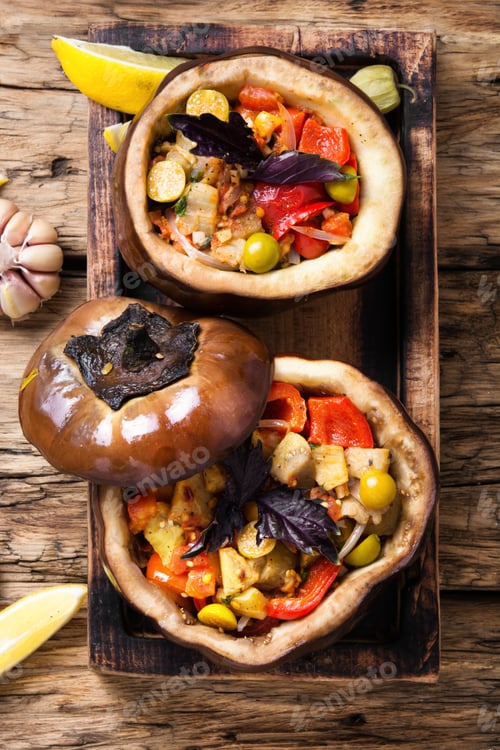 Preview: Baked Eggplant Stuffed With Vegetables On Old Wooden Background
