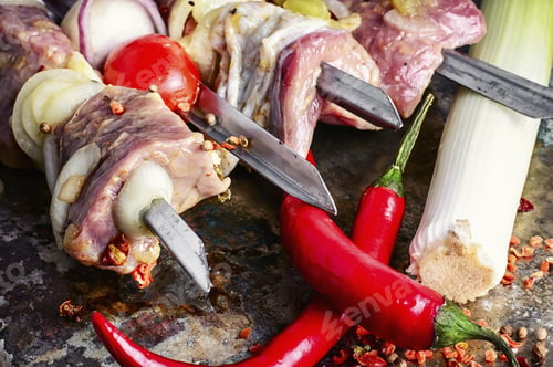 Preview: Raw Meat Marinated In Spices Threaded On Skewers