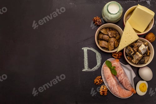 Preview: Foods Containing Vitamin D. Cheese, Eggs, Butter, Nuts, Milk, Sardine. Black Chalk Board Background