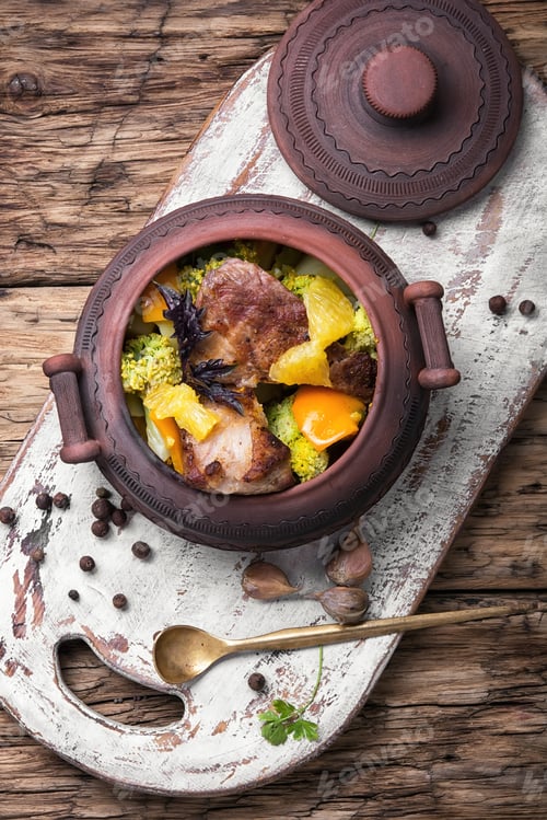 Preview: Baked Meat With Orange Sauce In A Rustic Pot
