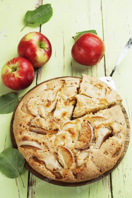 Preview: Apple Pie And Red Apples On A Wooden Table