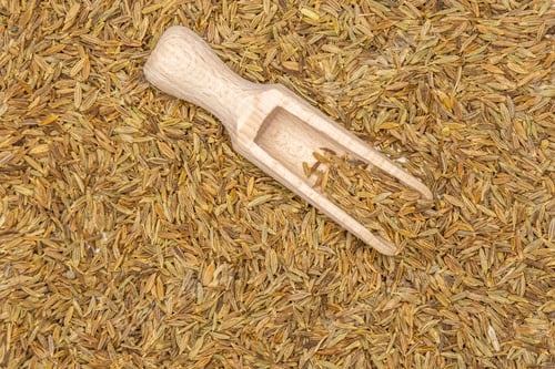 Preview: Lot Of Whole Roman Caraway Seeds With Wooden Scoop Flatlay Isolated