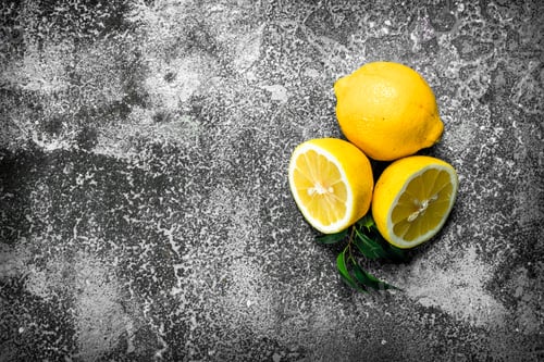 Preview: Fresh Lemons With Leaves. On A Rustic Background.