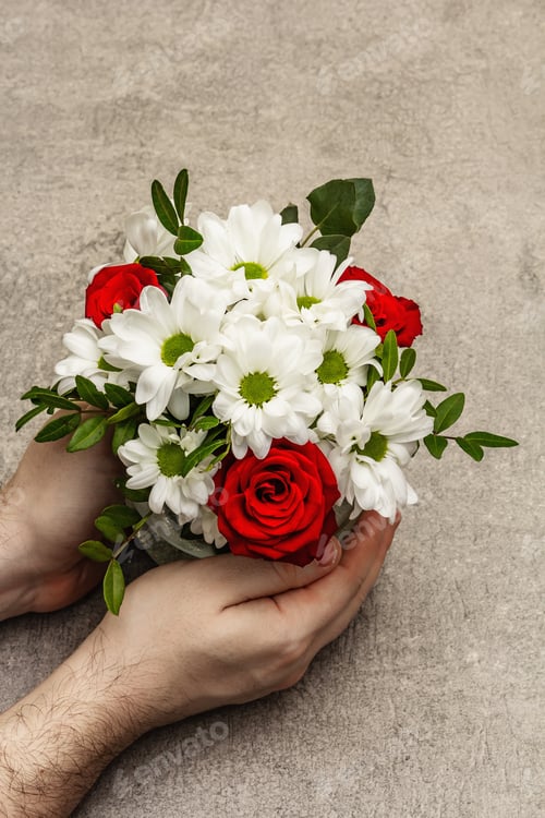 Preview: Valentine'S Day Or Happy Birthday Concept. Male Hands Are Holding A Bouquet Of Flowers. Scattered