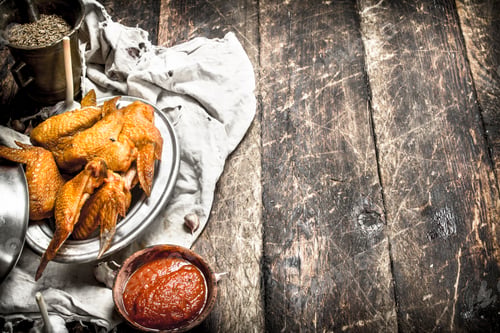 Preview: Smoked Chicken Wings With Sauce. On A Wooden Background.