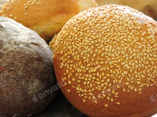 Preview: Bread Roll With Sesame And Rye Bread. Close Up.