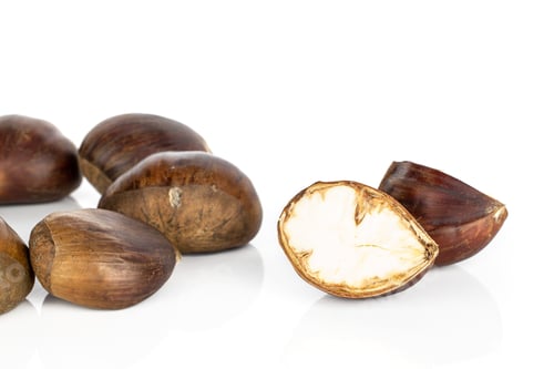 Preview: Group Of Five Whole Two Halves Of Edible Brown Chestnut Isolated On White Background