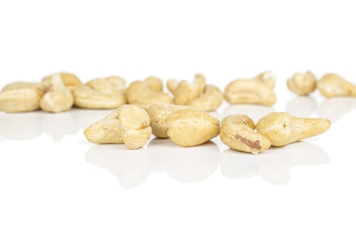 Preview: Lot Of Whole Light Brown Nut Cashew Front Focus Isolated On White Background