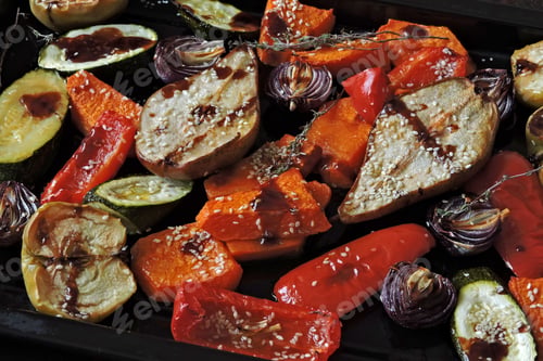 Preview: Baked Pumpkin, Zucchini, Paprika, Pear, Apple, Blue Onion With Herbs And Spices On A Baking Sheet