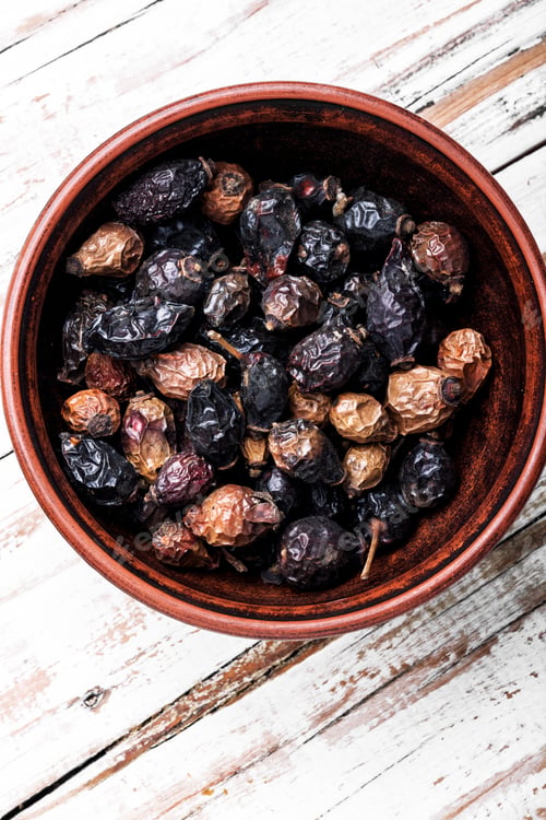 Preview: Dried Red Rose Hips In Bowl.Dried Red Fruits Of The Dog Rose