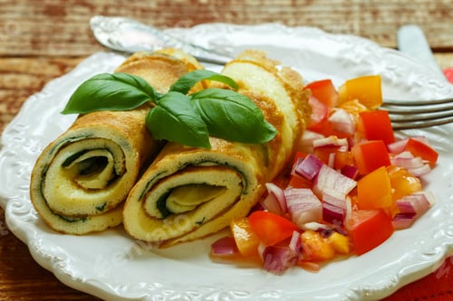 Preview: Traditional Breakfast. Omelette With Spinach And A Fresh Tomato Salad, Red Onion And Basil. Roll