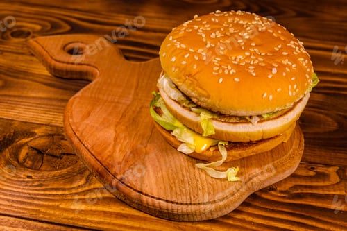 Preview: Fresh Hamburger On A Rustic Wooden Table