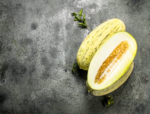 Preview: Fresh Ripe Sliced Melon. On A Rustic Background.