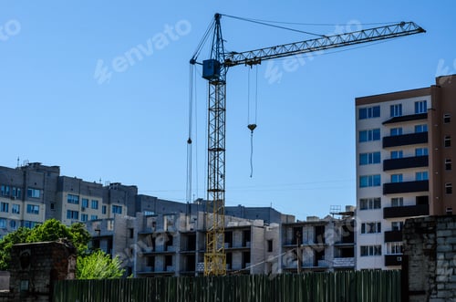 Preview: High Crane Against Blue Sky At A Construction Site