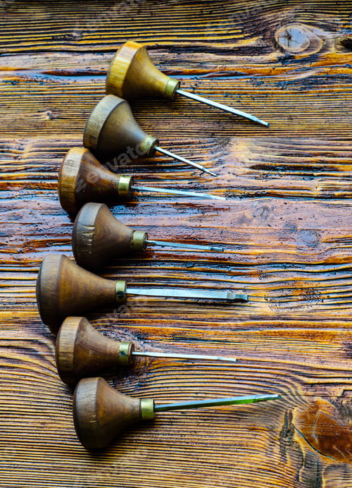 Preview: Different Gravers For Jewelry On A Wooden Background