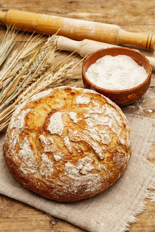 Preview: Fresh Baked Bread With Wheat Ears, Bowl Of Flour And Rolling Pins. Vintage Wooden Boards Table