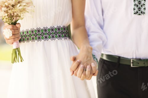 Preview: Married Couple Holding By Hands