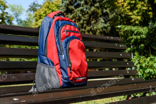 Preview: Tourist Backpack On Bench In City Park