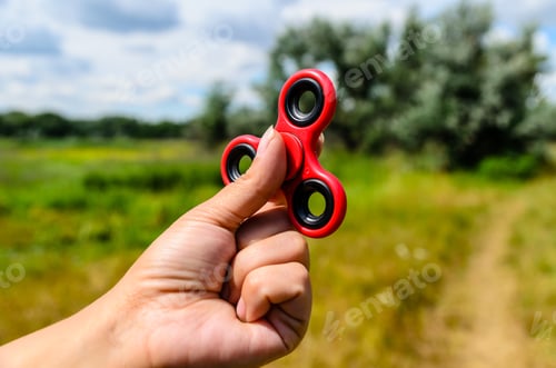 Preview: Red Fidget Spinner In A Female Hand