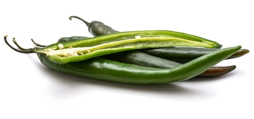 Preview: Heap Of Green Chili Peppers, Three Whole And One Half, Isolated On White Background