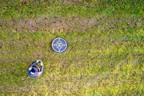 Preview: Drone Operator Aerial View With Landing And Take Off Target Pad Must Register Flying Quadcopter