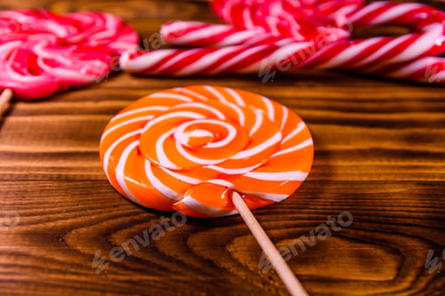 Preview: Different Sweet Lollipops On A Rustic Wooden Table