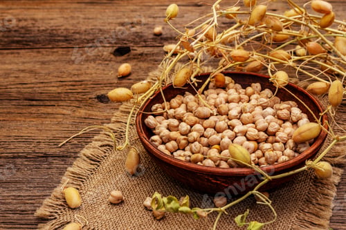 Preview: Dry Chickpea In Ceramic Bowl And It'S Own Branches On Old Wooden Boards Background. Traditional
