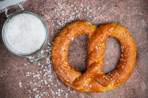 Preview: Freshly Baked Homemade Pretzel With Coarse Sea Salt. German (Bavarian) Beer Appetizer. Selective
