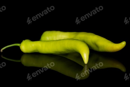 Preview: Group Of Two Whole Hot Green Pepper Banana Isolated On Black Glass