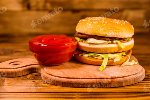 Preview: Hamburger And Sauce On Rustic Wooden Table