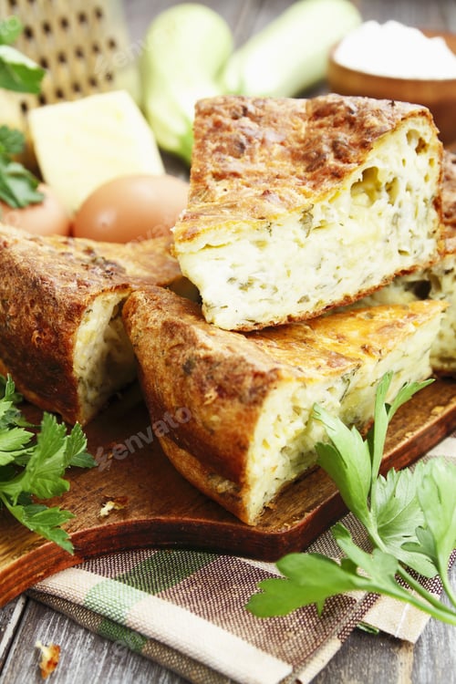 Preview: Pie With Zucchini, Cheese And Herbs On The Table