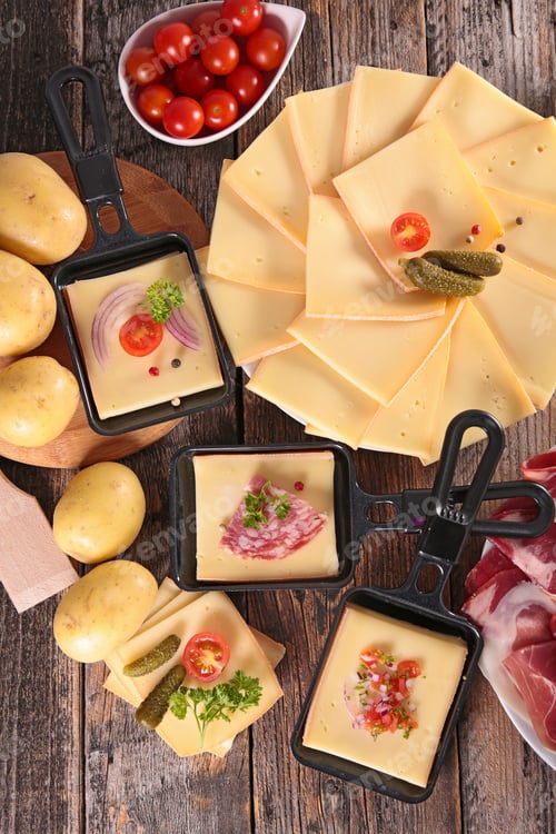 Delicious Raclette Cheese with Potatoes and Fresh Ingredients