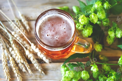 Preview: Selective Focus. A Glass Of Wheat Beer On A Wooden Surface. Wheat Ears And Hops.