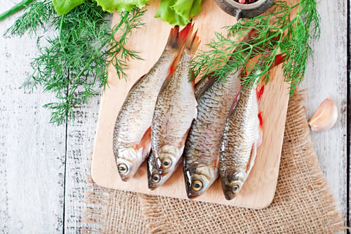 Preview: Prepared For Frying Fish Roach On The Wooden Background. Top View