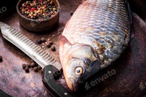 Preview: Fresh Fish Carp With Ingredients For Cooking On Pan. Seafood
